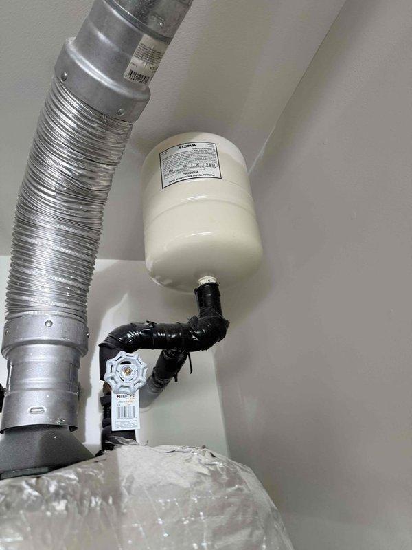 Completed estimate for property sale preparation involving replacement of corroded plumbing pipes, aging gas water heater with associated flexible gas line connections, and repair of multiple leaky faucets throughout the residence. Assessment included inspection of existing utility area installation with white PVC drainage assembly, yellow corrugated CSST gas line with brass fittings and red shut-off valves, water heater with safety controls, expansion tank with black piping connections, and aluminum HVAC ductwork.