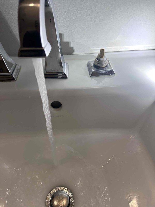 Responded to reported leak from sink and stiff handle on secondary fixture. Upon inspection, identified source of leak at primary sink faucet assembly. Tightened supply line connections and tested both fixtures under full water pressure. Lubricated stiff handle mechanism on secondary sink to restore smooth operation. Verified all connections were secure with no active leaks and confirmed proper drainage on both fixtures.