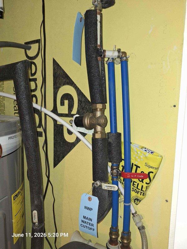 Responded to customer concern regarding hose bibb functionality following recent thermal expansion tank and cartridge service. Upon inspection, documented existing plumbing configuration including main water cutoff valve assembly, brass T-fittings with distribution points, PEX and PVC pipe connections with proper insulation, and red-handled ball valve installation. Verified hose bibb issue appears unrelated to previous work performed on thermal expansion system, as the hose bibb operates on separate branch line from the serviced components.