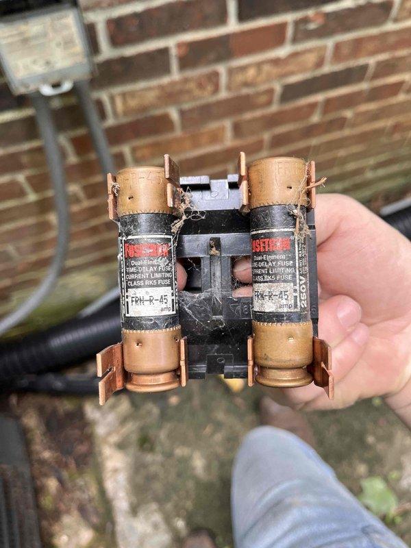 Responded to report of water leakage from furnace unit in crawlspace. Upon inspection, located condensate pump with drainage concerns and replaced failed dual current limiting fuses (FRN-R-45) that were preventing proper system operation. Installed new air filter to restore proper airflow, as previous filter was severely overdue for replacement. System tested and confirmed operational with no active water leaks detected at time of service.