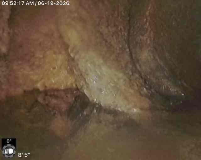 # Sewer Scope Inspection

Performed comprehensive video sewer scope inspection of underground sewer line. Located and marked access point at property exterior, designated as position 5 for reference. Advanced camera equipment through lateral sewer line to depth of 8 feet 5 inches. During inspection, identified significant moisture intrusion and possible structural degradation within the pipe system at zero-degree orientation. Documentation captured evidence of compromised pipe integrity with visible dampness and material deterioration affecting line condition. Complete video documentation provided for review and future reference regarding necessary repairs or line replacement considerations.