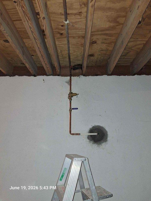 # Ringing Pipes Resolution

Responded to customer complaint of ringing pipes in residential plumbing system. Upon inspection, identified water hammer condition caused by inadequate air chambers and loose pipe mounting. Documented existing corroded brass pressure regulator and aging copper supply lines showing significant oxidation and wear. Secured loose piping runs to ceiling joists with appropriate hangers and added water hammer arrestor to vertical supply line. Tested system under normal flow conditions and verified elimination of noise. Recommended future replacement of corroded fittings and pressure regulator due to advanced deterioration.