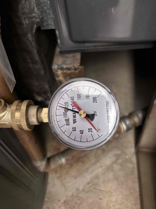 Responded to reported water pooling on side of property where county had already confirmed issue was on customer's side of service line. Upon arrival, observed significant water accumulation in yard with saturated soil and standing water in ground depression, indicating active leak in customer's water line. Performed pressure test on system which registered zero PSI, confirming complete loss of water pressure and verifying presence of underground leak between meter and structure. Documented conditions with photos showing extent of water damage and pressure gauge readings for customer records and potential repair planning.
