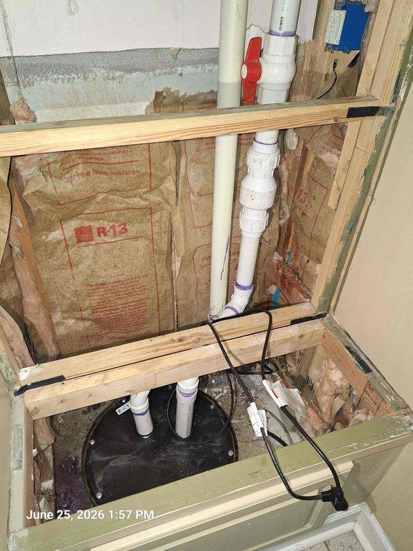 Responded to basement toilet leak. Upon inspection, discovered leaking wax ring at toilet flange connection allowing water to seep through floor into crawlspace below. Removed toilet, replaced failed wax ring and closet bolts, reinstalled toilet with proper seal, and verified all connections were secure and leak-free. Inspected surrounding plumbing lines and sump pump system for additional issues, confirmed all other components functioning properly with no signs of water damage to floor joists or insulation.