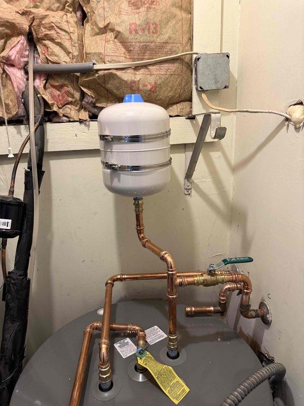Replaced water heater with new unit including installation of expansion tank, copper supply lines, brass fittings, and shutoff valves. Replaced two toilets with new fixtures including wax rings, supply lines, and mounting hardware. All plumbing connections were tested for proper operation and leaks upon completion.