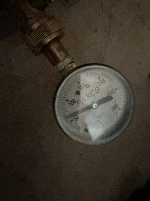 Responded to complaint of buzzing noise from recirculation pump. Upon inspection, identified excessive vibration from pump mounted on exposed plumbing system. Insulated copper piping with foam pipe insulation to reduce noise transmission through building structure. Verified system pressure using calibrated gauge, confirming operating pressure within normal parameters. Pump operation restored to quiet functioning condition with no further abnormal sounds detected during testing.