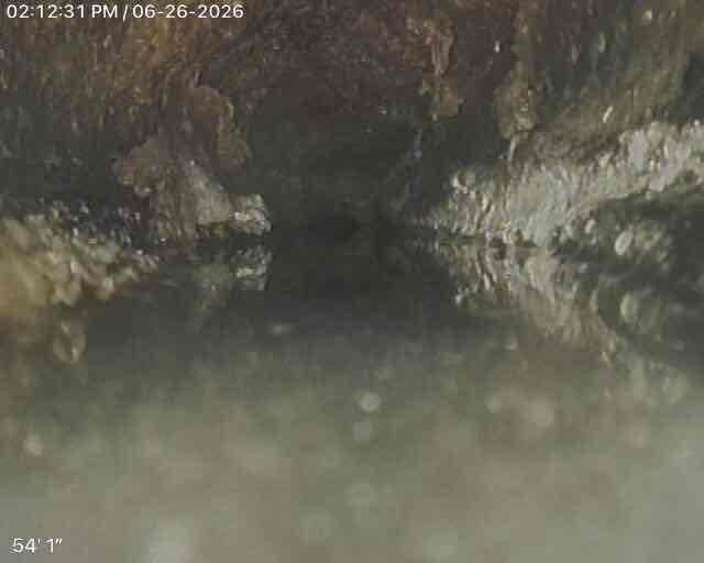 Responded to clogged toilet at multi-tenant residential property. Upon inspection, utilized drain camera to assess blockage location and severity at approximately 52-54 feet into the main drainage line. Camera inspection revealed significant accumulation of foreign material and debris causing complete obstruction of the pipe. Successfully cleared blockage using appropriate drain cleaning equipment and restored proper flow to the fixture. Verified clearance with follow-up camera inspection confirming full restoration of drainage capacity.