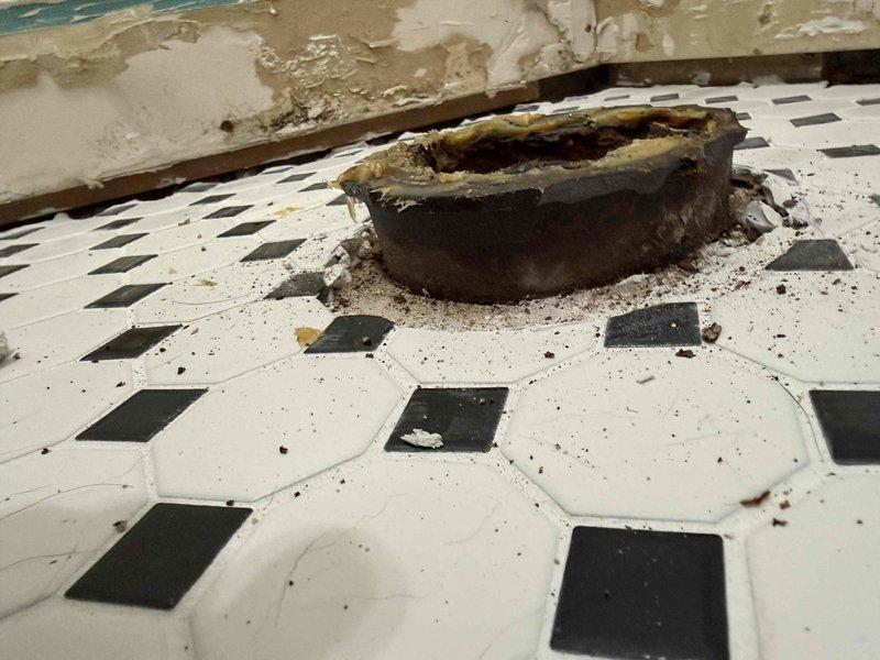 Provided estimate for cutting down toilet flange and tub drain to proper height following bathroom tile elevation adjustment. Both fixtures were protruding above the new tile surface and required modification to ensure proper installation and function of plumbing fixtures.