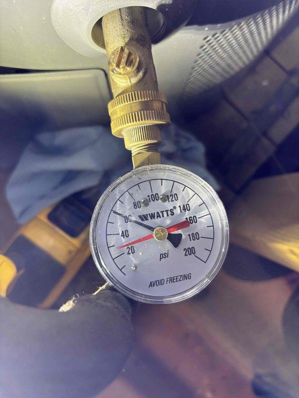Responded to complaint of loud rattling noises occurring sporadically every 5 minutes with suspected pressure reducing valve failure. Upon arrival, conducted system pressure diagnostics using calibrated pressure gauge to measure static and operating pressures at the PRV. Inspected Rheem water heater installation and associated plumbing components, including copper supply lines, valves, and pressure regulation equipment. Testing confirmed abnormal pressure fluctuations consistent with failing PRV diaphragm. Documented pressure readings and system configuration with photographs for service records.