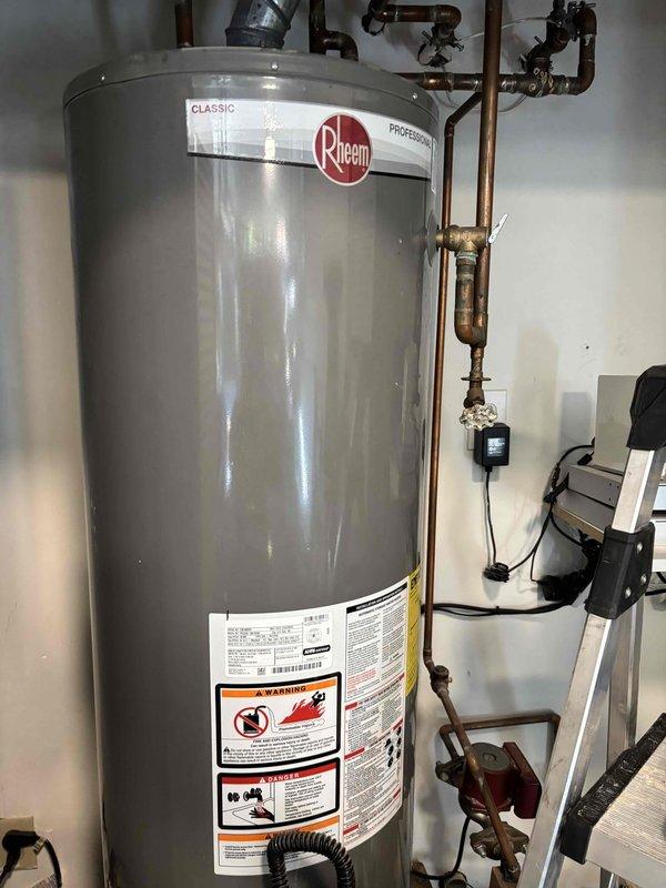 Responded to complaint of loud rattling noises occurring sporadically every 5 minutes with suspected pressure reducing valve failure. Upon arrival, conducted system pressure diagnostics using calibrated pressure gauge to measure static and operating pressures at the PRV. Inspected Rheem water heater installation and associated plumbing components, including copper supply lines, valves, and pressure regulation equipment. Testing confirmed abnormal pressure fluctuations consistent with failing PRV diaphragm. Documented pressure readings and system configuration with photographs for service records.