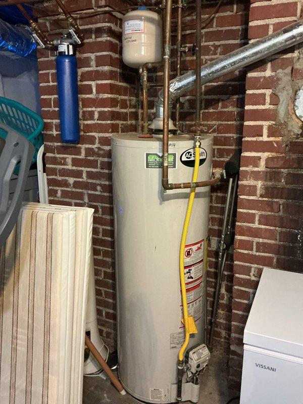 Performed sewer scope inspection at property with accessible cleanout. Camera inspection revealed standard residential sewer line conditions with no immediate blockages or structural concerns identified during the evaluation. Documentation completed with photographic records of basement utility area showing water heater, HVAC system, and plumbing infrastructure for customer reference.