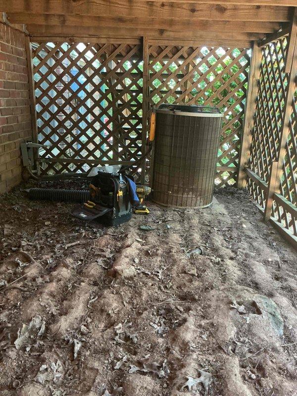 Responded to no cooling call where outdoor condensing unit was not operating while indoor air handler was functioning. Upon arrival, inspected outdoor unit located in latticed enclosure beneath deck. Found unit completely inoperative with no power to compressor or condenser fan motor. Tested electrical connections at disconnect and verified incoming voltage present. Traced power supply through control circuit and identified failed contactor preventing unit from energizing. Replaced defective contactor and confirmed proper voltage delivery to compressor and fan motor. Cycled system multiple times to verify reliable operation. Outdoor unit now operating normally with proper amperage draw on both compressor and condenser fan. System cooling effectively with indoor and outdoor units communicating properly. Cleared work area and restored unit to full operational status.