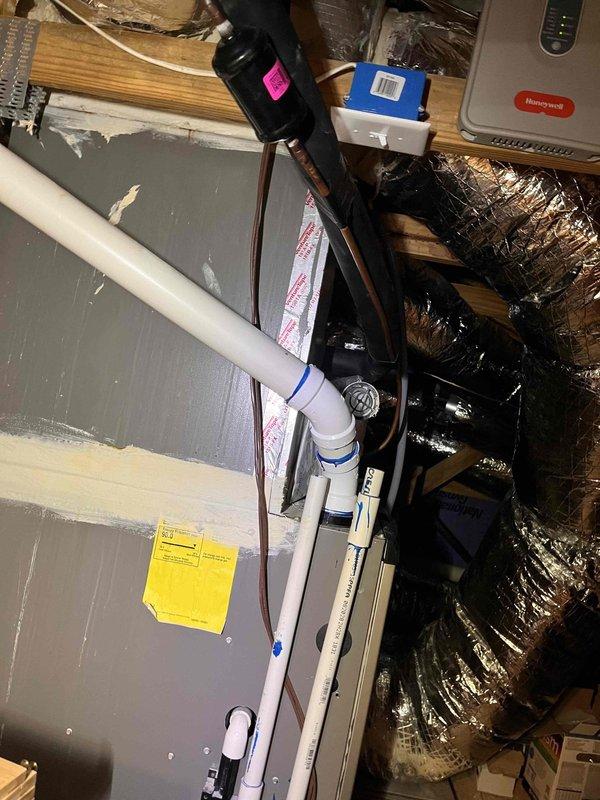 Completed routine HVAC maintenance on residential split system, servicing both indoor air handler unit located in attic crawl space and outdoor condensing unit. Outdoor condenser coils were heavily soiled with dirt and debris accumulation, requiring thorough cleaning to restore proper airflow and heat transfer efficiency. Unable to access equipment secured within locked protective cage; will require key from property owner on follow-up visit to complete full inspection and service of caged unit. Completed routine HVAC maintenance on residential split system, servicing both indoor air handler unit located in attic crawl space and outdoor condensing unit. Outdoor condenser coils were heavily soiled with dirt and debris accumulation, requiring thorough cleaning to restore proper airflow and heat transfer efficiency. Unable to access equipment secured within locked protective cage; will require key from property owner on follow-up visit to complete full inspection and service of caged unit.