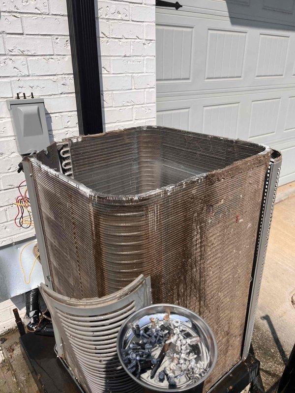 Completed routine HVAC maintenance on residential split system, servicing both indoor air handler unit located in attic crawl space and outdoor condensing unit. Outdoor condenser coils were heavily soiled with dirt and debris accumulation, requiring thorough cleaning to restore proper airflow and heat transfer efficiency. Unable to access equipment secured within locked protective cage; will require key from property owner on follow-up visit to complete full inspection and service of caged unit. Completed routine HVAC maintenance on residential split system, servicing both indoor air handler unit located in attic crawl space and outdoor condensing unit. Outdoor condenser coils were heavily soiled with dirt and debris accumulation, requiring thorough cleaning to restore proper airflow and heat transfer efficiency. Unable to access equipment secured within locked protective cage; will require key from property owner on follow-up visit to complete full inspection and service of caged unit.