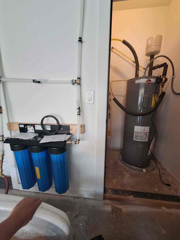 Installed water pressure booster pump system in utility room to address low water pressure issues. Connected booster pump to existing copper plumbing lines, integrated with water heater and filtration system, and tested all connections for proper operation and pressure output. Installed water pressure booster pump system in utility room to address low water pressure issues. Connected booster pump to existing copper plumbing lines, integrated with water heater and filtration system, and tested all connections for proper operation and pressure output.