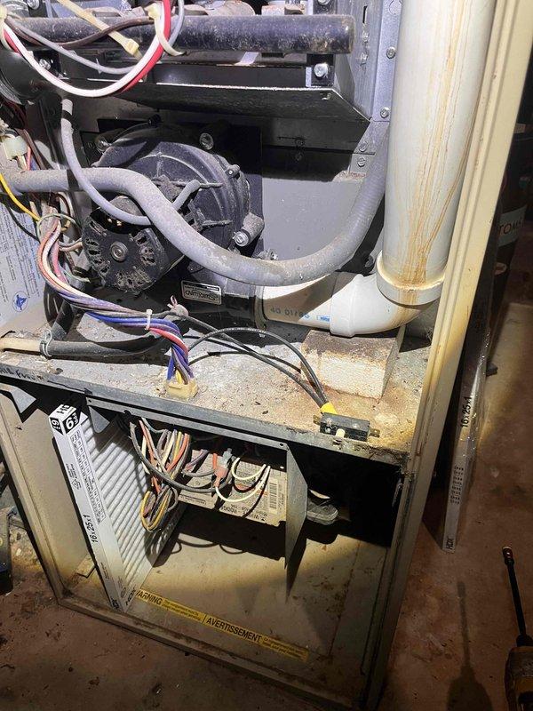Responded to no cooling call and performed diagnostic inspection of HVAC system. Accessed furnace unit and examined blower motor assembly, refrigerant lines, and electrical connections. Inspected air filter condition and verified proper installation. Checked electrical panel and circuit breaker configuration to ensure adequate power supply to HVAC equipment. System components showed normal wear with dust accumulation but no immediate failures identified during visual inspection.