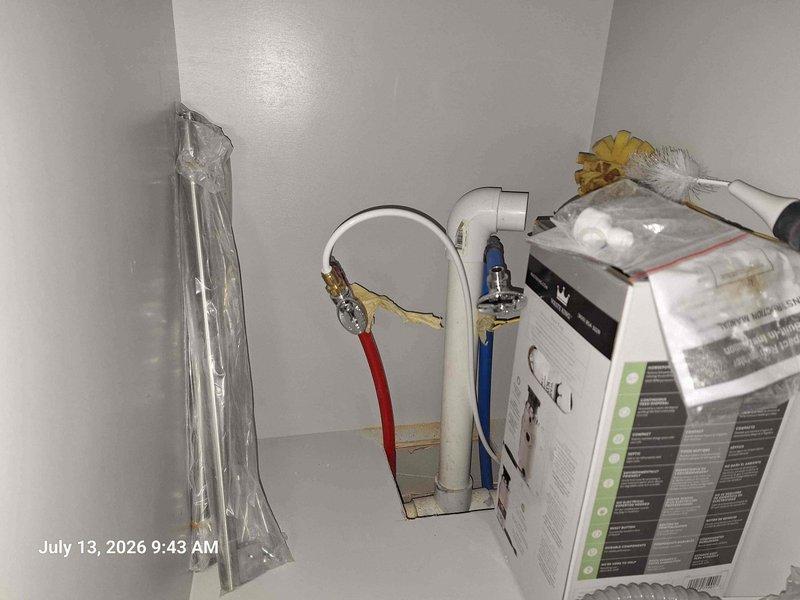 Completed on-site estimate for faucet replacement and drain line relocation. Assessed existing plumbing configuration under sink cabinet, including current water supply lines with braided flexible connectors and shut-off valves mounted on PVC supply pipes. Evaluated accessibility and existing connections to determine scope of work for new faucet installation and drain line modifications required to meet customer specifications.