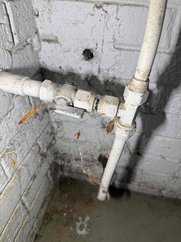 Responded to service call regarding multiple plumbing and gas concerns at residential property. Conducted comprehensive inspection of water heater system, thermal expansion tank piping, and garage gas line. Evaluated existing expansion tank configuration and identified bent piping requiring replacement recommendation. Inspected copper piping connections, brass fittings, and PVC drainage system for proper operation. Assessed hot water temperature settings and pressure relief components for safety compliance. Performed gas leak detection testing on garage gas line to verify system integrity and rule out potential hazards. Examined backup water pressure line for functionality issues. Documented current plumbing configuration with photographs showing water heater assembly, expansion tanks, copper supply lines, and drainage piping. Provided customer with detailed estimate for necessary piping replacement and system adjustments to address identified concerns. Responded to service call regarding multiple plumbing and gas concerns at residential property. Conducted comprehensive inspection of water heater system, thermal expansion tank piping, and garage gas line. Evaluated existing expansion tank configuration and identified bent piping requiring replacement recommendation. Inspected copper piping connections, brass fittings, and PVC drainage system for proper operation. Assessed hot water temperature settings and pressure relief components for safety compliance. Performed gas leak detection testing on garage gas line to verify system integrity and rule out potential hazards. Examined backup water pressure line for functionality issues. Documented current plumbing configuration with photographs showing water heater assembly, expansion tanks, copper supply lines, and drainage piping. Provided customer with detailed estimate for necessary piping replacement and system adjustments to address identified concerns.