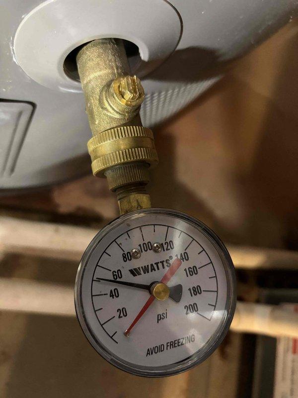Responded to report of water staining on master bathroom ceiling and dripping faucet in guest bathroom. Inspected ceiling area and documented water damage with visible yellowish-brown discoloration indicating previous moisture infiltration, though no active leak was present at time of inspection. Tested water pressure at heater location, which registered approximately 100 psi on gauge. Evaluated guest bathroom sink faucet and confirmed right handle requires specific positioning to prevent dripping, indicating worn cartridge or valve seat requiring replacement to ensure proper shutoff function. Responded to report of water staining on master bathroom ceiling and dripping faucet in guest bathroom. Inspected ceiling area and documented water damage with visible yellowish-brown discoloration indicating previous moisture infiltration, though no active leak was present at time of inspection. Tested water pressure at heater location, which registered approximately 100 psi on gauge. Evaluated guest bathroom sink faucet and confirmed right handle requires specific positioning to prevent dripping, indicating worn cartridge or valve seat requiring replacement to ensure proper shutoff function.