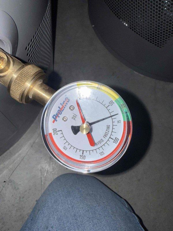 Responded to service call for toilet making screeching noise when flushed and sewer/moldy odor emanating from laundry room sink. Performed diagnostic assessment of toilet flush mechanism and inspected laundry room plumbing system for potential drain venting issues or P-trap problems causing odor. Documented existing plumbing conditions with photographs, including water pressure gauge reading and current kitchen sink plumbing configuration. Consulted with property owner regarding feasibility of relocating laundry room from lower level to upper level, which would require assessment of water supply lines, drain routing, and structural considerations for future planning.