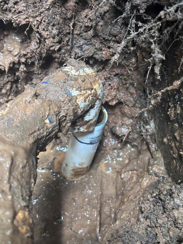 Responded to emergency water leak at front spigot where water was pouring out from under the home despite customer's attempt to use shut-off valve. Excavated foundation area near exterior spigot to expose underground plumbing, located failed PVC pipe coupling in saturated soil, and documented damage to underground water supply line for repair recommendations. Responded to emergency water leak at front spigot where water was pouring out from under the home despite customer's attempt to use shut-off valve. Excavated foundation area near exterior spigot to expose underground plumbing, located failed PVC pipe coupling in saturated soil, and documented damage to underground water supply line for repair recommendations.