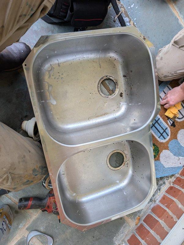 Responded to service call for clogged garbage disposal and kitchen faucet issues. Upon assessment, successfully cleared the disposal blockage and installed a new kitchen faucet with pull-out spray head attachment and matching soap dispenser. Rather than replacing the entire sink assembly, performed adjustment and repositioning of the existing double-basin stainless steel sink to ensure proper fit and function within the granite countertop. All components tested and verified operational upon completion. Responded to service call for clogged garbage disposal and kitchen faucet issues. Upon assessment, successfully cleared the disposal blockage and installed a new kitchen faucet with pull-out spray head attachment and matching soap dispenser. Rather than replacing the entire sink assembly, performed adjustment and repositioning of the existing double-basin stainless steel sink to ensure proper fit and function within the granite countertop. All components tested and verified operational upon completion.