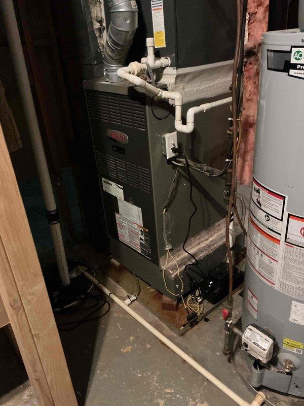 Responded to noise complaint regarding condensate pump on Lennox furnace system. Upon inspection, confirmed HVAC system maintaining proper heating and cooling operation despite audible noise from condensate pump. Documented equipment condition with photographs of indoor furnace installation and outdoor condenser unit for service records. Responded to noise complaint regarding condensate pump on Lennox furnace system. Upon inspection, confirmed HVAC system maintaining proper heating and cooling operation despite audible noise from condensate pump. Documented equipment condition with photographs of indoor furnace installation and outdoor condenser unit for service records.