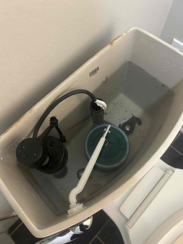 Responded to clogged toilet service call and performed diagnostic inspection of fixture and internal components. Removed tank lid and inspected flush valve assembly, fill valve mechanism, and flapper system for proper operation. Verified water supply line connection at wall and tank inlet valve for adequate flow and potential restrictions. Assessed tank water level and refill cycle to ensure proper flushing capacity. Inspected internal tank components for mineral buildup and debris that could impair flush performance. All plumbing connections and supply lines found secure with no visible leaks. Toilet restored to proper working condition.