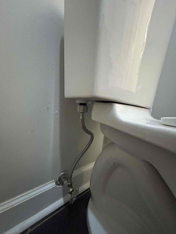 Responded to clogged toilet service call and performed diagnostic inspection of fixture and internal components. Removed tank lid and inspected flush valve assembly, fill valve mechanism, and flapper system for proper operation. Verified water supply line connection at wall and tank inlet valve for adequate flow and potential restrictions. Assessed tank water level and refill cycle to ensure proper flushing capacity. Inspected internal tank components for mineral buildup and debris that could impair flush performance. All plumbing connections and supply lines found secure with no visible leaks. Toilet restored to proper working condition.