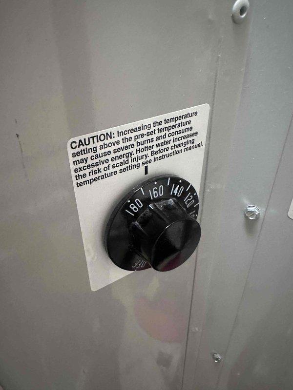 Responded to service request to adjust water heater temperature setting. Upon arrival, located the temperature control dial on the equipment's control panel, which displayed a range from 80 to 180 degrees Fahrenheit. Reduced the temperature setting by rotating the dial to a lower position per customer request, ensuring the new setting would provide adequate hot water while reducing energy consumption and minimizing scalding risk. Verified the caution label regarding temperature adjustment and scald prevention was clearly visible and legible on the control panel. Documented the adjusted temperature control setting with photographs for service records. Responded to service request to adjust water heater temperature setting. Upon arrival, located the temperature control dial on the equipment's control panel, which displayed a range from 80 to 180 degrees Fahrenheit. Reduced the temperature setting by rotating the dial to a lower position per customer request, ensuring the new setting would provide adequate hot water while reducing energy consumption and minimizing scalding risk. Verified the caution label regarding temperature adjustment and scald prevention was clearly visible and legible on the control panel. Documented the adjusted temperature control setting with photographs for service records.