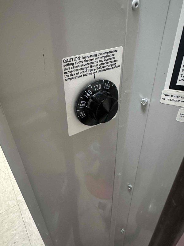 Responded to service request to adjust water heater temperature setting. Upon arrival, located the temperature control dial on the equipment's control panel, which displayed a range from 80 to 180 degrees Fahrenheit. Reduced the temperature setting by rotating the dial to a lower position per customer request, ensuring the new setting would provide adequate hot water while reducing energy consumption and minimizing scalding risk. Verified the caution label regarding temperature adjustment and scald prevention was clearly visible and legible on the control panel. Documented the adjusted temperature control setting with photographs for service records. Responded to service request to adjust water heater temperature setting. Upon arrival, located the temperature control dial on the equipment's control panel, which displayed a range from 80 to 180 degrees Fahrenheit. Reduced the temperature setting by rotating the dial to a lower position per customer request, ensuring the new setting would provide adequate hot water while reducing energy consumption and minimizing scalding risk. Verified the caution label regarding temperature adjustment and scald prevention was clearly visible and legible on the control panel. Documented the adjusted temperature control setting with photographs for service records.