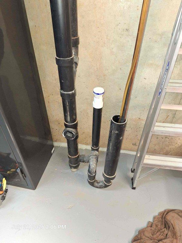 Responded to service call for condensate line backup causing overflow through basement vent cap onto floor. Inspected drainage system in mechanical room, identified blockage in condensate drain line, and cleared obstruction to restore proper drainage flow. Secured loose undermount kitchen sink that had detached from countertop mounting points, ensuring proper support and preventing further separation from granite surface. Responded to service call for condensate line backup causing overflow through basement vent cap onto floor. Inspected drainage system in mechanical room, identified blockage in condensate drain line, and cleared obstruction to restore proper drainage flow. Secured loose undermount kitchen sink that had detached from countertop mounting points, ensuring proper support and preventing further separation from granite surface.