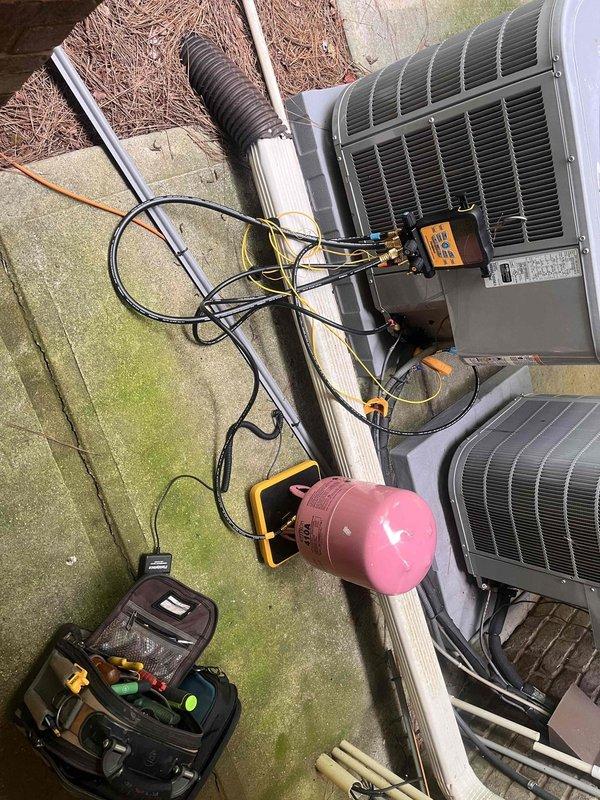 Roswell, GA - Performed refrigerant recharge service on residential air conditioning system. Connected manifold gauges and recovery equipment to assess system pressures, then added R-410A refrigerant to manufacturer specifications to restore proper cooling capacity and system performance. Roswell, GA - Performed refrigerant recharge service on residential air conditioning system. Connected manifold gauges and recovery equipment to assess system pressures, then added R-410A refrigerant to manufacturer specifications to restore proper cooling capacity and system performance.