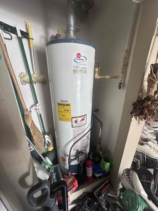 Responded to reported ceiling leak and conducted thorough inspection of premises. Investigation traced moisture source to water heater installation in utility closet, where condensation and minor seepage were observed on copper supply lines and brass fittings at top connections. Inspected adjacent plumbing fixtures including bathtub spout, noting water droplets and recent moisture presence. Documented conditions with photographic evidence showing water heater unit, surrounding plumbing infrastructure, and affected fixtures for assessment and recommended follow-up repairs to prevent further water intrusion. Responded to reported ceiling leak and conducted thorough inspection of premises. Investigation traced moisture source to water heater installation in utility closet, where condensation and minor seepage were observed on copper supply lines and brass fittings at top connections. Inspected adjacent plumbing fixtures including bathtub spout, noting water droplets and recent moisture presence. Documented conditions with photographic evidence showing water heater unit, surrounding plumbing infrastructure, and affected fixtures for assessment and recommended follow-up repairs to prevent further water intrusion.