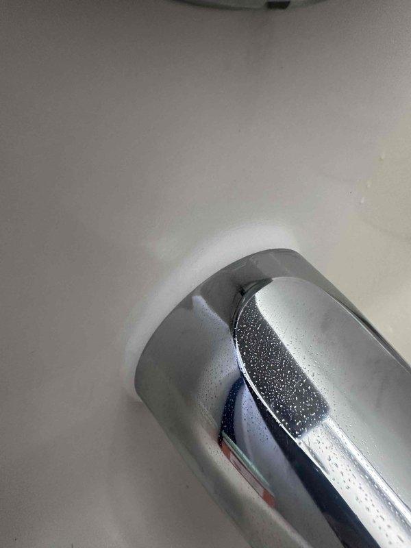 Responded to reported ceiling leak and conducted thorough inspection of premises. Investigation traced moisture source to water heater installation in utility closet, where condensation and minor seepage were observed on copper supply lines and brass fittings at top connections. Inspected adjacent plumbing fixtures including bathtub spout, noting water droplets and recent moisture presence. Documented conditions with photographic evidence showing water heater unit, surrounding plumbing infrastructure, and affected fixtures for assessment and recommended follow-up repairs to prevent further water intrusion. Responded to reported ceiling leak and conducted thorough inspection of premises. Investigation traced moisture source to water heater installation in utility closet, where condensation and minor seepage were observed on copper supply lines and brass fittings at top connections. Inspected adjacent plumbing fixtures including bathtub spout, noting water droplets and recent moisture presence. Documented conditions with photographic evidence showing water heater unit, surrounding plumbing infrastructure, and affected fixtures for assessment and recommended follow-up repairs to prevent further water intrusion.