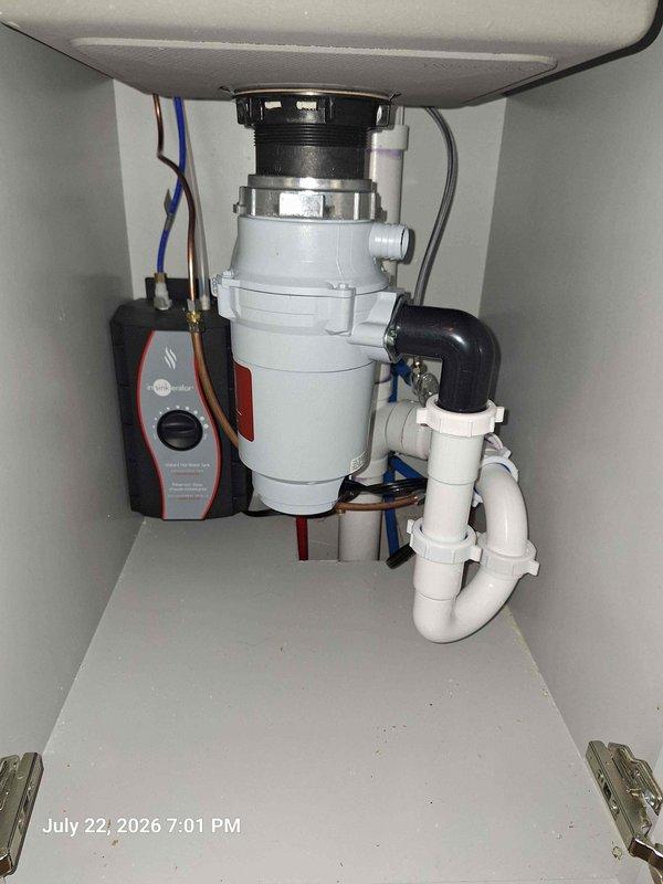 Completed installation of bar faucet and drain assembly per specifications. Additionally, connected existing Rinnai tankless water heater to recirculation pump system, establishing proper operational integration between both units. All plumbing connections tested and verified leak-free with system functioning as intended.