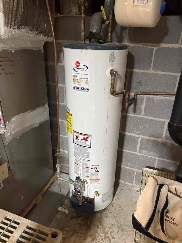 Responded to service call for non-operational water heater. Upon arrival, inspected Rheem residential water heater unit located in basement utility area. Verified proper gas supply at exterior meter, confirmed all supply valves in open position, and tested electrical connections. Identified pilot light failure as primary issue. Performed diagnostic testing of thermocouple and gas control valve assembly. Cleaned pilot assembly, replaced faulty thermocouple, and successfully relit pilot light. Verified proper burner ignition sequence and confirmed water heater returned to normal operation with adequate hot water production. Responded to service call for non-operational water heater. Upon arrival, inspected Rheem residential water heater unit located in basement utility area. Verified proper gas supply at exterior meter, confirmed all supply valves in open position, and tested electrical connections. Identified pilot light failure as primary issue. Performed diagnostic testing of thermocouple and gas control valve assembly. Cleaned pilot assembly, replaced faulty thermocouple, and successfully relit pilot light. Verified proper burner ignition sequence and confirmed water heater returned to normal operation with adequate hot water production.