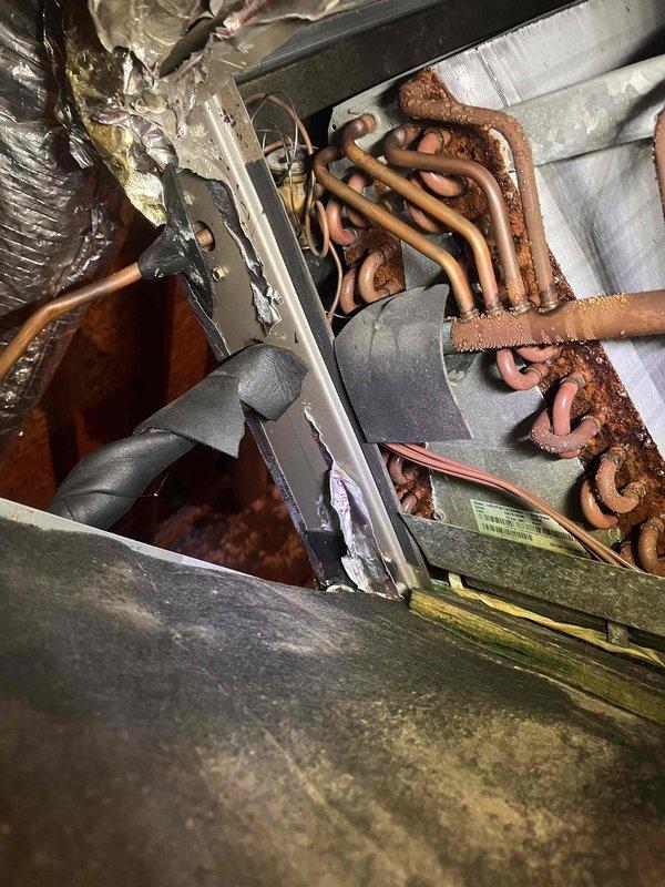 Completed comprehensive maintenance on two HVAC systems located in attic space. Inspection revealed significant corrosion on copper refrigerant lines requiring monitoring, along with damaged and deteriorated ductwork insulation in the lower sections of the installation. Both air handler units were serviced, and all accessible components were evaluated for proper operation and structural integrity. Completed comprehensive maintenance on two HVAC systems located in attic space. Inspection revealed significant corrosion on copper refrigerant lines requiring monitoring, along with damaged and deteriorated ductwork insulation in the lower sections of the installation. Both air handler units were serviced, and all accessible components were evaluated for proper operation and structural integrity.