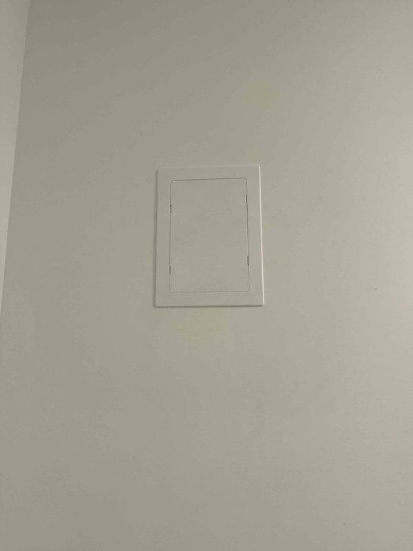 Inspected and serviced pressure relief valve (PRV) on water heating system. Accessed equipment through wall-mounted panel, verified proper valve operation, and confirmed secure mounting within drain pan. All components functioning within normal parameters upon completion.