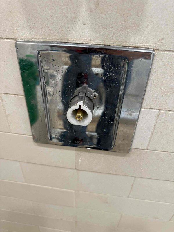 Responded to service call for multiple leaking faucets. Inspected shower valve access panel showing significant moisture accumulation, water spotting, and mineral deposits on interior surfaces, indicating active leak from valve assembly. Examined under-sink plumbing configuration with P-trap and supply lines in proper working order. Addressed leak issues at both fixtures to restore proper function and prevent further water damage. Responded to service call for multiple leaking faucets. Inspected shower valve access panel showing significant moisture accumulation, water spotting, and mineral deposits on interior surfaces, indicating active leak from valve assembly. Examined under-sink plumbing configuration with P-trap and supply lines in proper working order. Addressed leak issues at both fixtures to restore proper function and prevent further water damage.