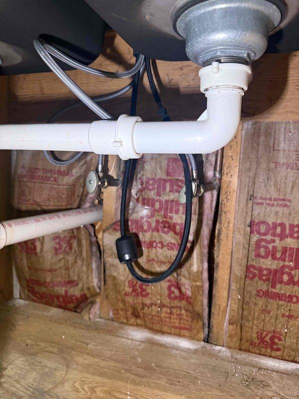 Responded to service call for multiple leaking faucets. Inspected shower valve access panel showing significant moisture accumulation, water spotting, and mineral deposits on interior surfaces, indicating active leak from valve assembly. Examined under-sink plumbing configuration with P-trap and supply lines in proper working order. Addressed leak issues at both fixtures to restore proper function and prevent further water damage. Responded to service call for multiple leaking faucets. Inspected shower valve access panel showing significant moisture accumulation, water spotting, and mineral deposits on interior surfaces, indicating active leak from valve assembly. Examined under-sink plumbing configuration with P-trap and supply lines in proper working order. Addressed leak issues at both fixtures to restore proper function and prevent further water damage.
