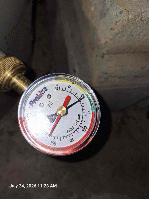 Responded to customer complaint of high water bill and low water pressure. Performed pressure test at main water line, which revealed abnormally low static pressure reading on calibrated gauge. Upon inspection of bathroom plumbing fixtures and surrounding areas, identified active leak condition requiring immediate repair to restore proper system pressure and prevent further water waste.