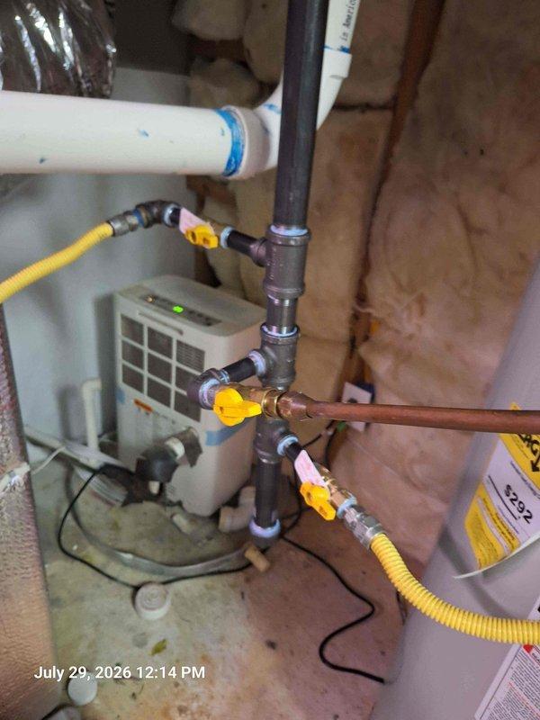 Completed gas line repair and safety inspection in utility room. Installed new gas shutoff valves with yellow handles at water heater connection point, replaced flexible yellow gas connector lines, and secured all fittings to code specifications. Verified proper gas flow, tested all connections for leaks using approved detection methods, and confirmed safe operation of water heater. All work performed in accordance with local gas fitting regulations and manufacturer specifications. Completed gas line repair and safety inspection in utility room. Installed new gas shutoff valves with yellow handles at water heater connection point, replaced flexible yellow gas connector lines, and secured all fittings to code specifications. Verified proper gas flow, tested all connections for leaks using approved detection methods, and confirmed safe operation of water heater. All work performed in accordance with local gas fitting regulations and manufacturer specifications.
