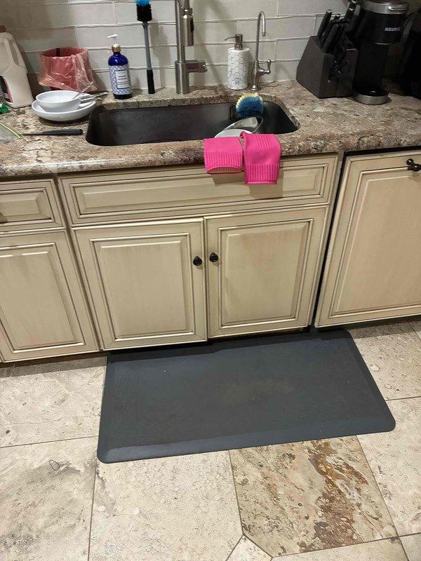 Responded to customer concern regarding hot bathroom floor tile indicating potential leak. Conducted thorough inspection of bathroom vanity plumbing, kitchen sink connections, and surrounding areas. Inspected all visible water supply lines, drain connections, and shut-off valves for signs of moisture, corrosion, or active leaks. Checked beneath vanity cabinet and kitchen sink base for water damage or dampness. Documented conditions with photographs showing no visible water intrusion, staining, or moisture damage to cabinetry, flooring, or surrounding areas. Advised customer that hot floor tile may be caused by hot water supply line routing beneath flooring or radiant heating system rather than active leak, as no evidence of water leakage was detected during inspection. Responded to customer concern regarding hot bathroom floor tile indicating potential leak. Conducted thorough inspection of bathroom vanity plumbing, kitchen sink connections, and surrounding areas. Inspected all visible water supply lines, drain connections, and shut-off valves for signs of moisture, corrosion, or active leaks. Checked beneath vanity cabinet and kitchen sink base for water damage or dampness. Documented conditions with photographs showing no visible water intrusion, staining, or moisture damage to cabinetry, flooring, or surrounding areas. Advised customer that hot floor tile may be caused by hot water supply line routing beneath flooring or radiant heating system rather than active leak, as no evidence of water leakage was detected during inspection.