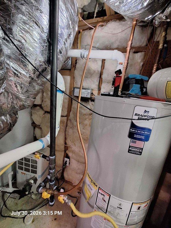 Responded to gas odor complaint and performed comprehensive safety inspection of water heater and gas connections. Inspected Bradford White water heater installation, yellow flexible gas line (CSST), all connection points, and surrounding utility area. Checked gas piping in attic space and verified proper routing of copper lines and gas supply. No active gas leaks detected during inspection. All connections tested and confirmed secure. Water heater operating normally with proper venting and no signs of gas escape at appliance or distribution points. Responded to gas odor complaint and performed comprehensive safety inspection of water heater and gas connections. Inspected Bradford White water heater installation, yellow flexible gas line (CSST), all connection points, and surrounding utility area. Checked gas piping in attic space and verified proper routing of copper lines and gas supply. No active gas leaks detected during inspection. All connections tested and confirmed secure. Water heater operating normally with proper venting and no signs of gas escape at appliance or distribution points.