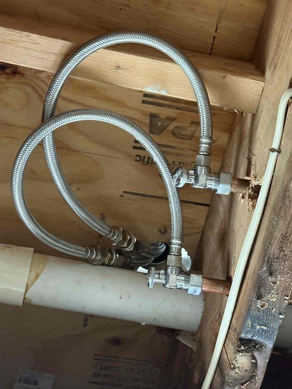 Responded to water leak emergency with water dripping through ceiling from master bathroom above. Inspected plumbing system beneath bathroom floor and identified failed flexible supply line connections at fixture. Customer had already shut off main water supply to prevent further damage. Documented existing water staining on ceiling and compromised supply line installation for repair recommendations. Responded to water leak emergency with water dripping through ceiling from master bathroom above. Inspected plumbing system beneath bathroom floor and identified failed flexible supply line connections at fixture. Customer had already shut off main water supply to prevent further damage. Documented existing water staining on ceiling and compromised supply line installation for repair recommendations.