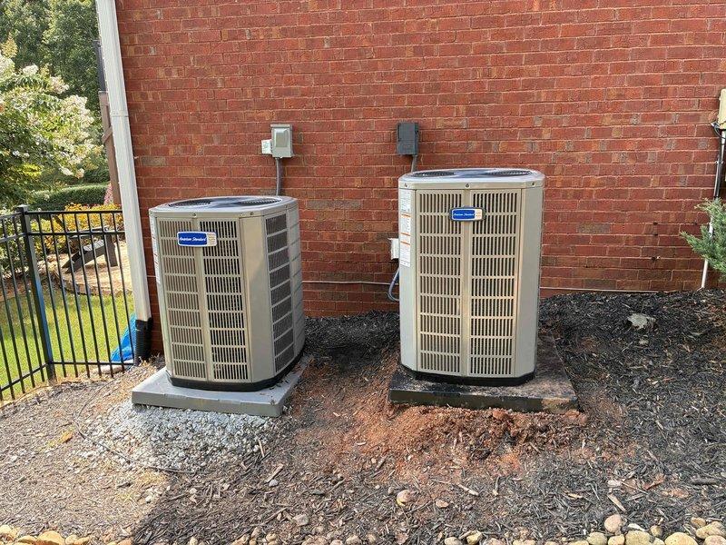 Roswell, GA - Picked up complete HVAC system equipment from Lawrenceville Team Air location, including 824 thermostat. Documentation photos captured dual outdoor condenser units installed on concrete pads against brick exterior with electrical disconnects properly mounted. Roswell, GA - Picked up complete HVAC system equipment from Lawrenceville Team Air location, including 824 thermostat. Documentation photos captured dual outdoor condenser units installed on concrete pads against brick exterior with electrical disconnects properly mounted.