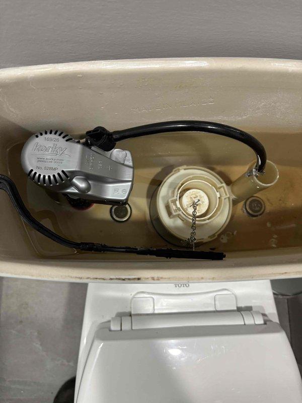 Completed toilet tank repair by replacing defective fill valve and supply line. Installed new Korky brand fill valve assembly with proper float adjustment and connected refill tube to flush valve overflow. Replaced worn supply line to ensure proper water flow and prevent potential leaks. Tested system operation to verify proper tank filling, water level adjustment, and shutoff functionality. All components now operating within manufacturer specifications. Completed toilet tank repair by replacing defective fill valve and supply line. Installed new Korky brand fill valve assembly with proper float adjustment and connected refill tube to flush valve overflow. Replaced worn supply line to ensure proper water flow and prevent potential leaks. Tested system operation to verify proper tank filling, water level adjustment, and shutoff functionality. All components now operating within manufacturer specifications.