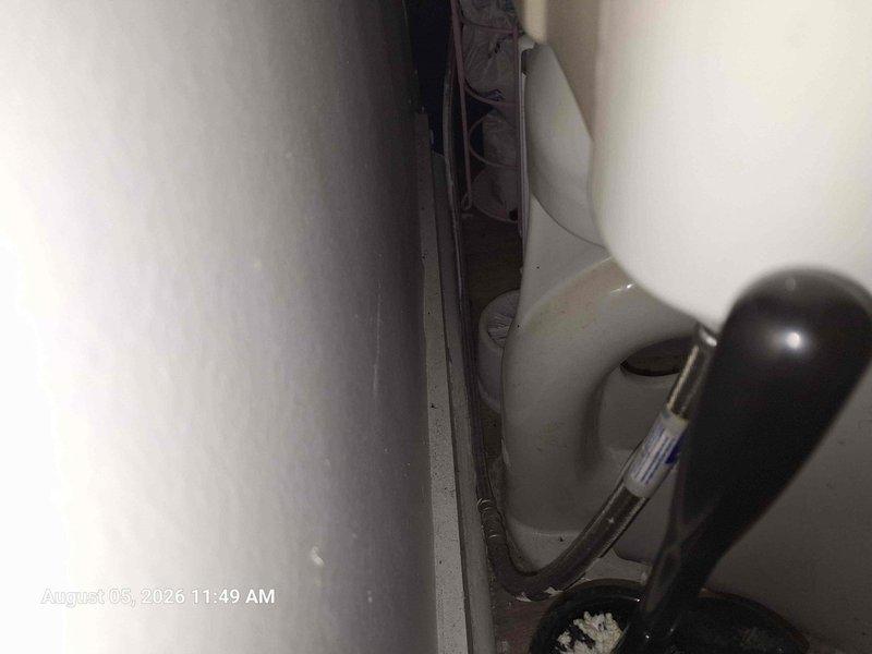 Performed comprehensive crawlspace inspection to identify source of reported leak and verify integrity of all plumbing connections. Inspected horizontal PVC drainage lines secured with support straps along floor joists, examining all visible connection points and joints for signs of moisture intrusion or compromised seals. Documented condition of exposed plumbing infrastructure including corrugated flex tubing and associated components in confined utility access areas. Noted deteriorated insulation material showing evidence of compression, moisture exposure, and accumulated debris beneath drainage lines. All accessible pipe connections and fittings were visually examined for active leaks, water staining, or structural concerns. Photographic documentation captured for customer records showing current state of crawlspace plumbing system and surrounding conditions. Performed comprehensive crawlspace inspection to identify source of reported leak and verify integrity of all plumbing connections. Inspected horizontal PVC drainage lines secured with support straps along floor joists, examining all visible connection points and joints for signs of moisture intrusion or compromised seals. Documented condition of exposed plumbing infrastructure including corrugated flex tubing and associated components in confined utility access areas. Noted deteriorated insulation material showing evidence of compression, moisture exposure, and accumulated debris beneath drainage lines. All accessible pipe connections and fittings were visually examined for active leaks, water staining, or structural concerns. Photographic documentation captured for customer records showing current state of crawlspace plumbing system and surrounding conditions.