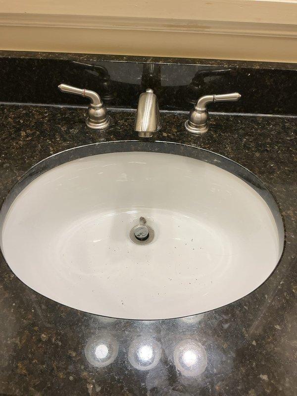Dunwoody, GA - Responded to report of two non-functioning faucets at bathroom vanity. Inspected widespread three-piece faucet assembly with brushed nickel finish mounted on dark granite countertop with undermount sink. Diagnosed and repaired both faucet handles to restore full operational functionality. Dunwoody, GA - Responded to report of two non-functioning faucets at bathroom vanity. Inspected widespread three-piece faucet assembly with brushed nickel finish mounted on dark granite countertop with undermount sink. Diagnosed and repaired both faucet handles to restore full operational functionality.